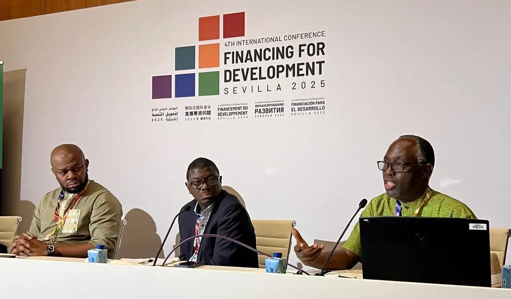 Three panellists speaking at the Fourth International Conference on Financing for Development in Seville