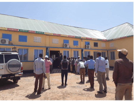 People gathered outside an airport terminal building in Somalia