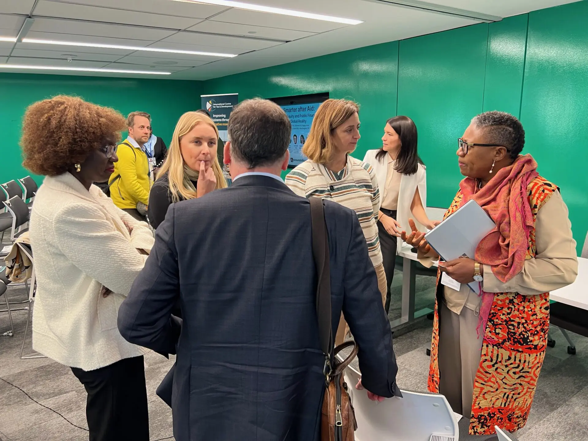 Participants talking in small groups after the Taxing Smarter after Aid event