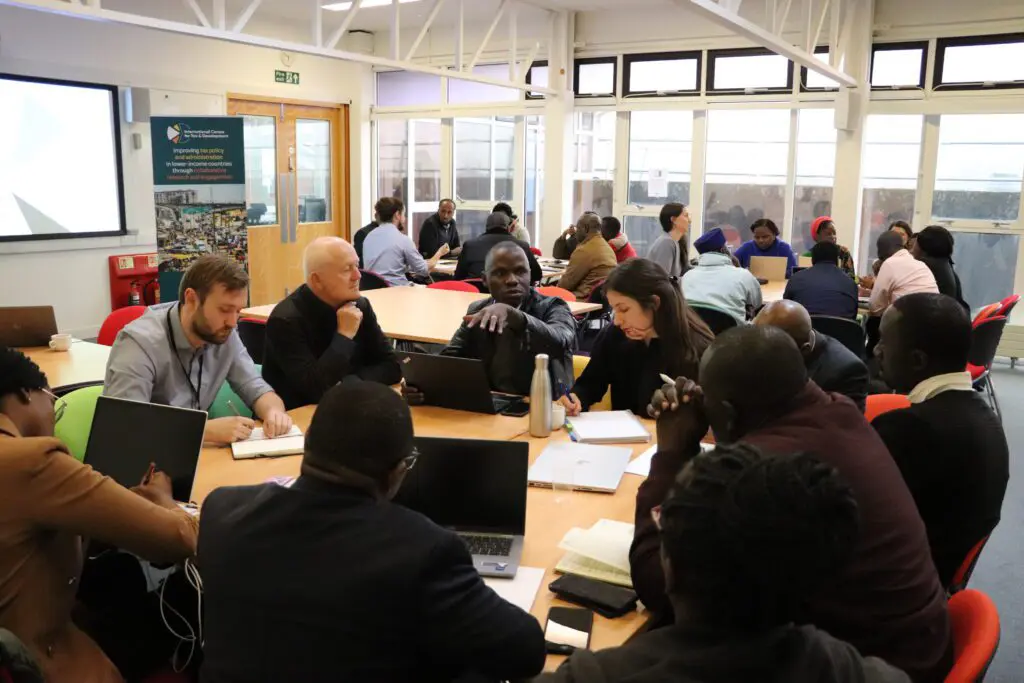 Participants in group discussions during a workshop session
