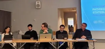 Panel discussion with five speakers including Vanessa van den Boogaard (first from the left)