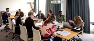 ATI Consultative Group members in a meeting around a conference table