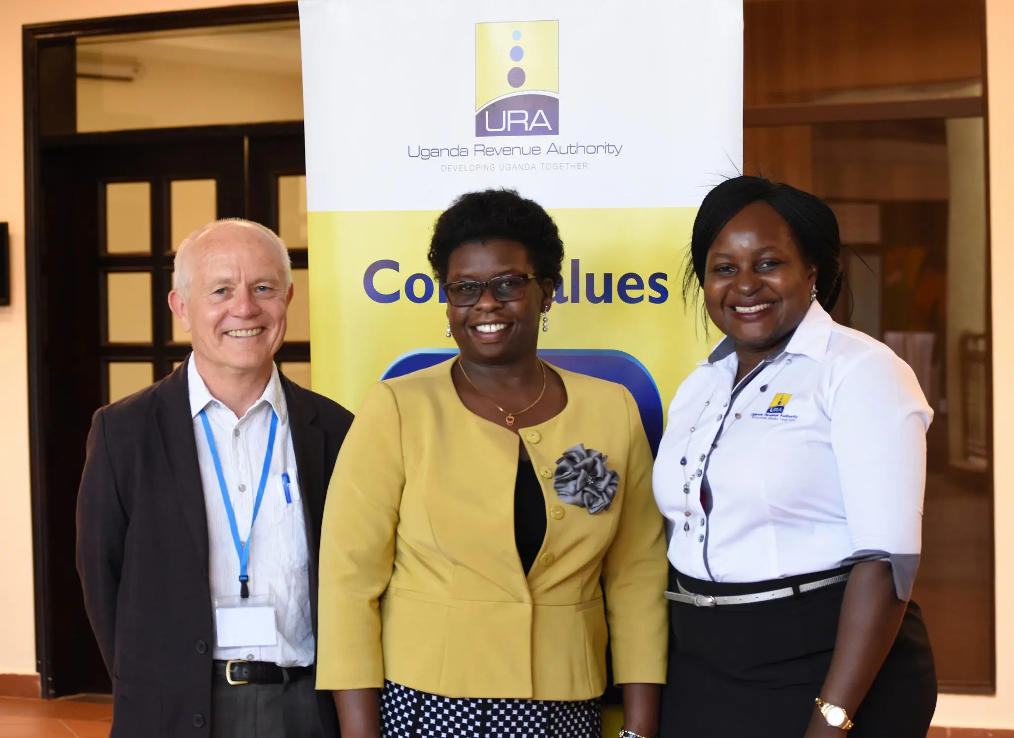 Mick Moore with Doris Akol and a colleague from the Uganda Revenue Authority