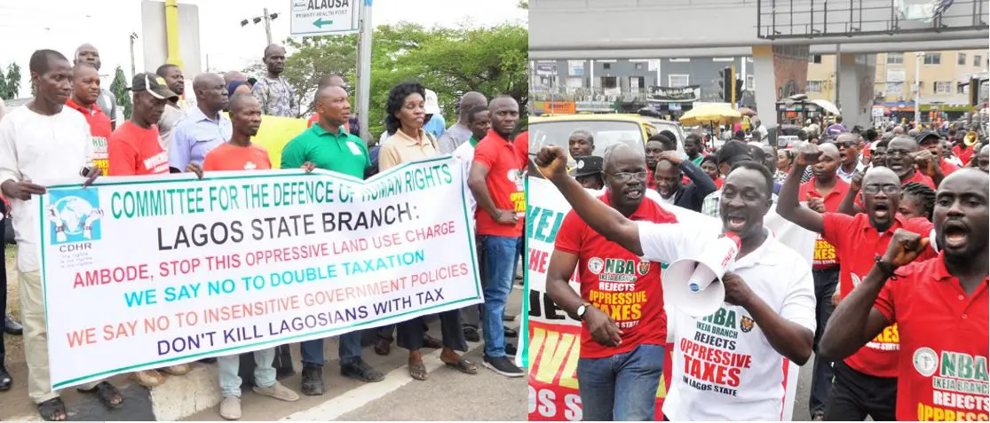 Protesters in Lagos holding banners against the Land Use Charge