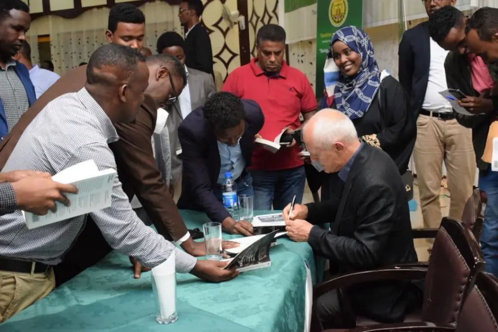 Mick Moore signing copies of Taxing Africa in Hargeisa