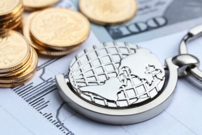 Coins, paper money and globe on white Statistic form background.