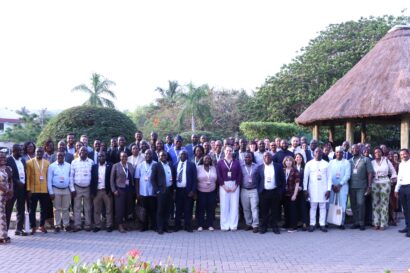 Wide shot of a large group of people facing the camera.