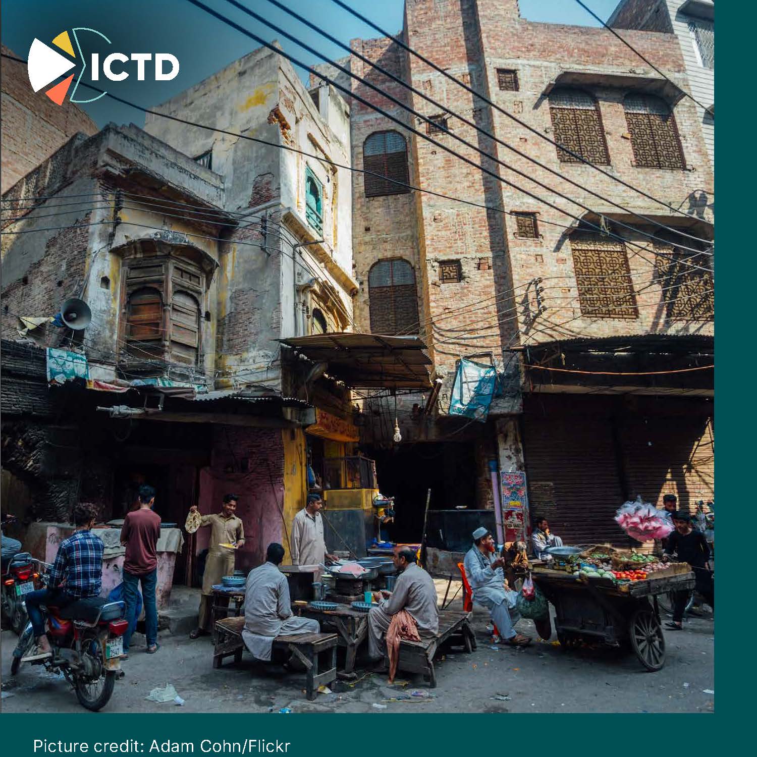 Slide 6 of 8: a busy street market in an old quarter of a Pakistani city